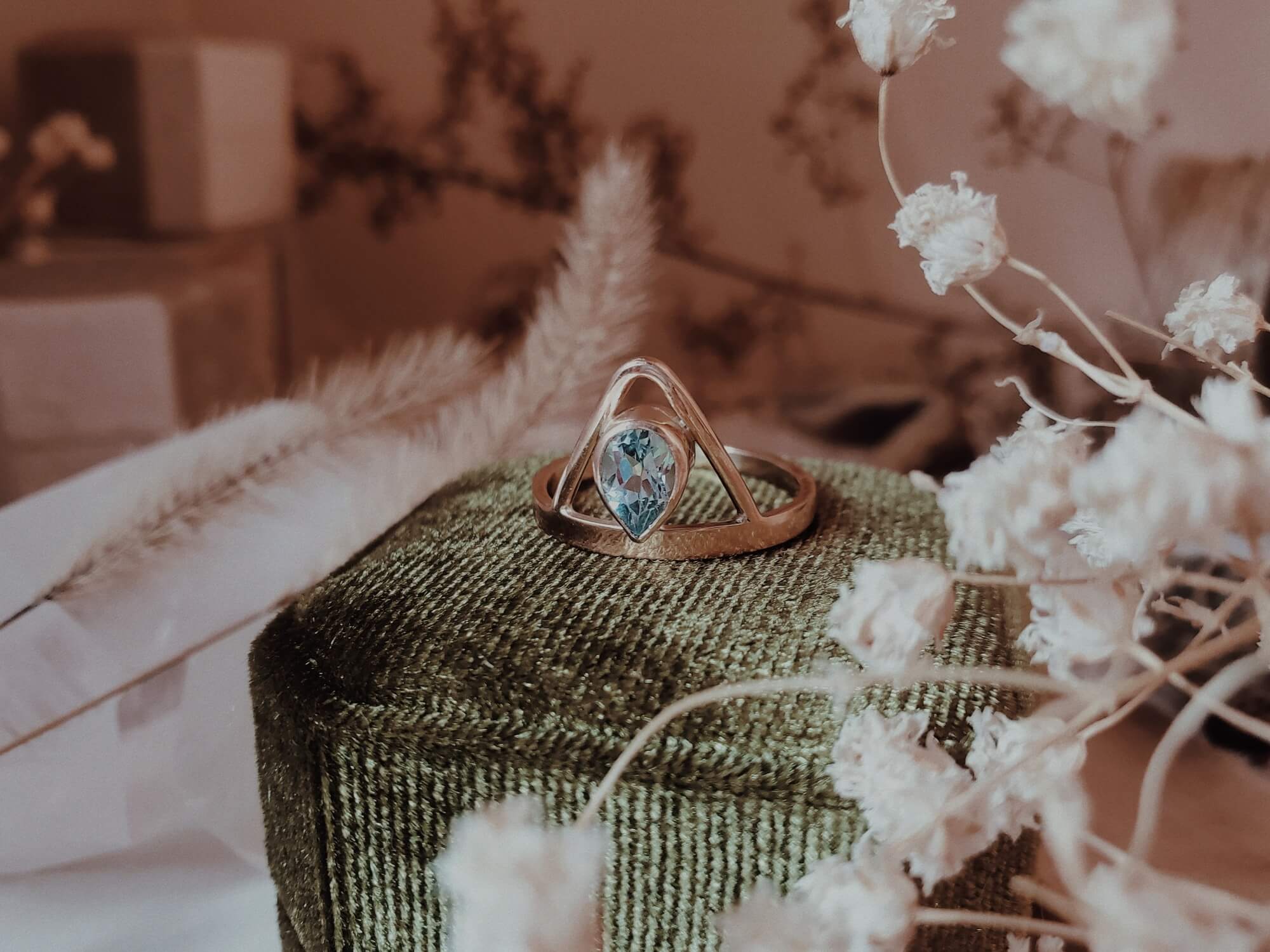 Dauntless Heart Pear Aquamarine Ring on Green Velvet Ring Box